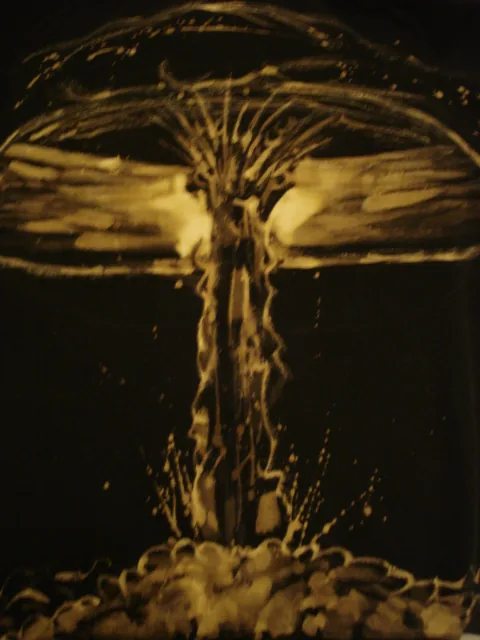 Bleach-painted mushroom cloud on a dark shirt