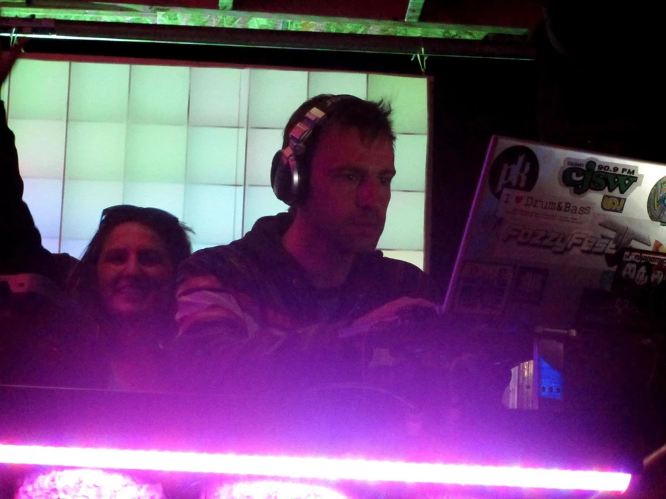 DJ working at FozzyFest with the Pixelator grid glowing behind him