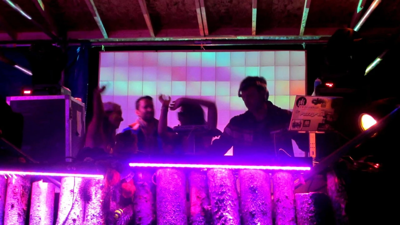 FozzyFest DJ booth with the illuminated Pixelator stage backdrop