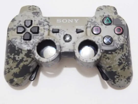 Front white-background photograph of camo PlayStation controller sunglasses