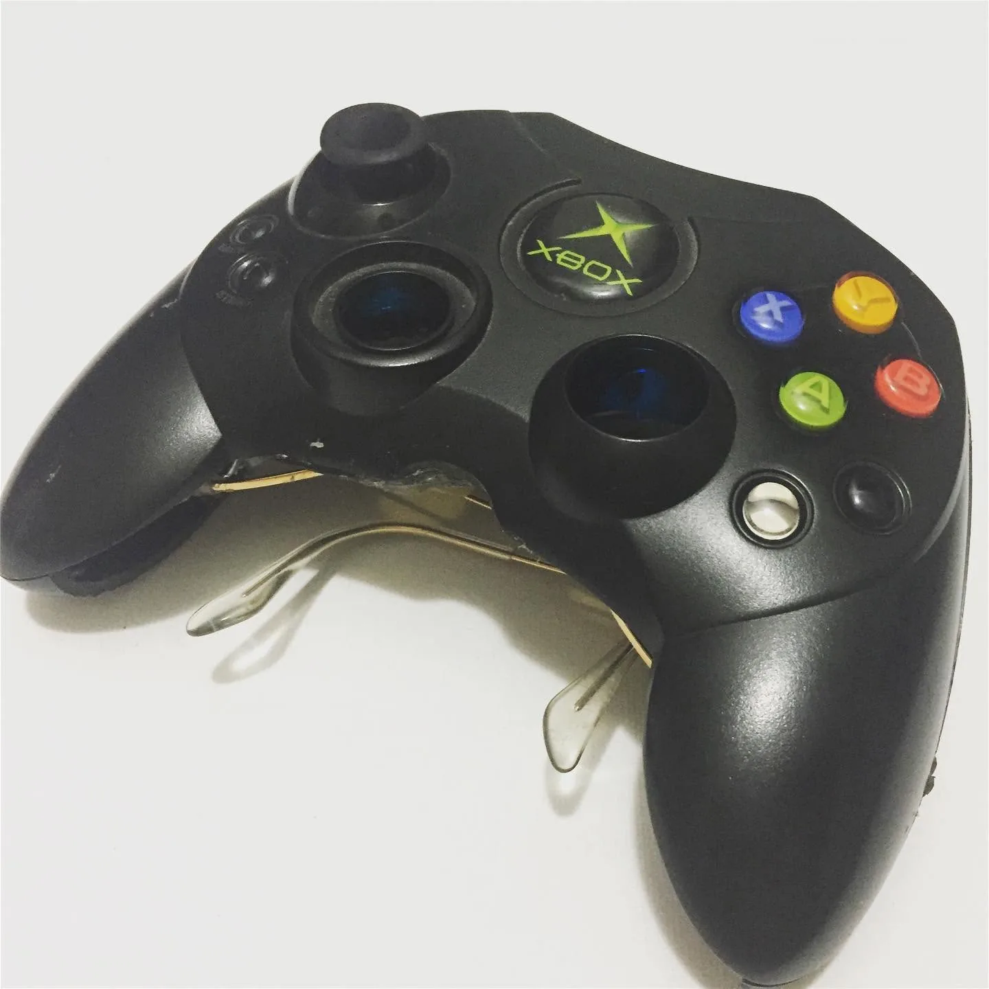 Front white-background photograph of Xbox controller sunglasses