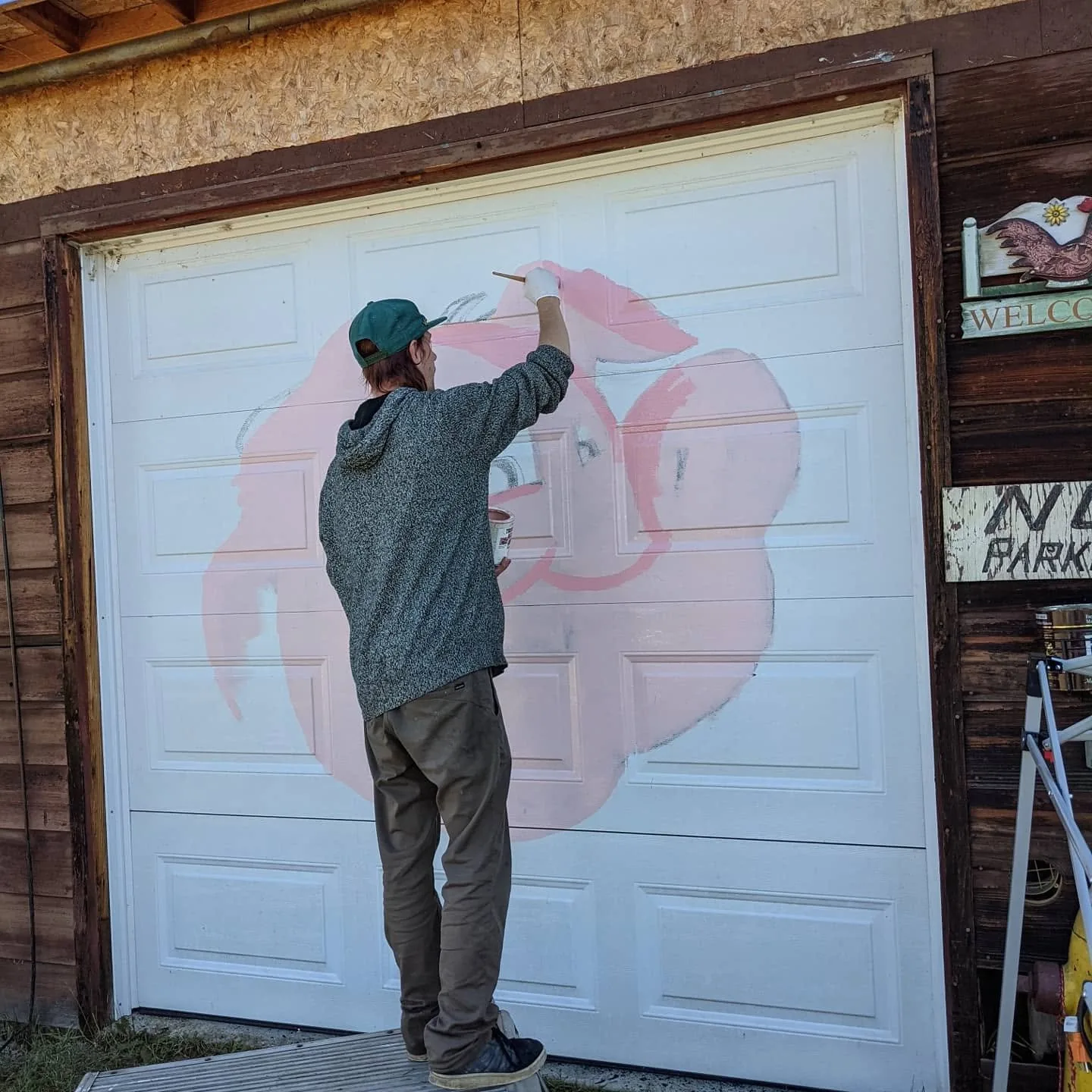Pink paint block-in on the garage door