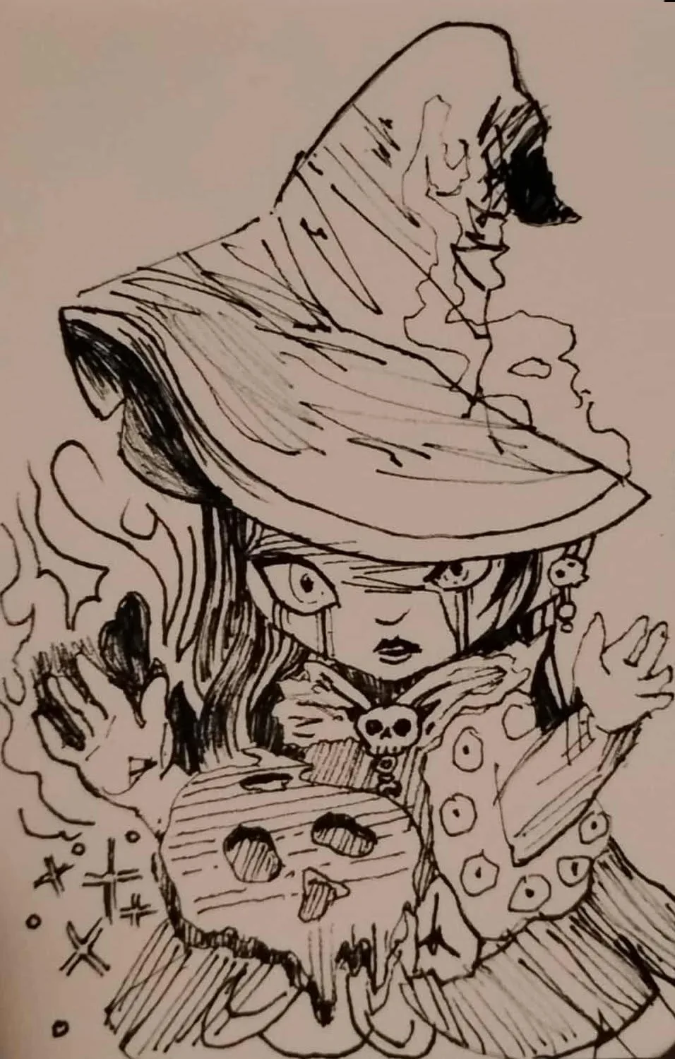 Ink illustration of a witch holding a skull among pumpkins