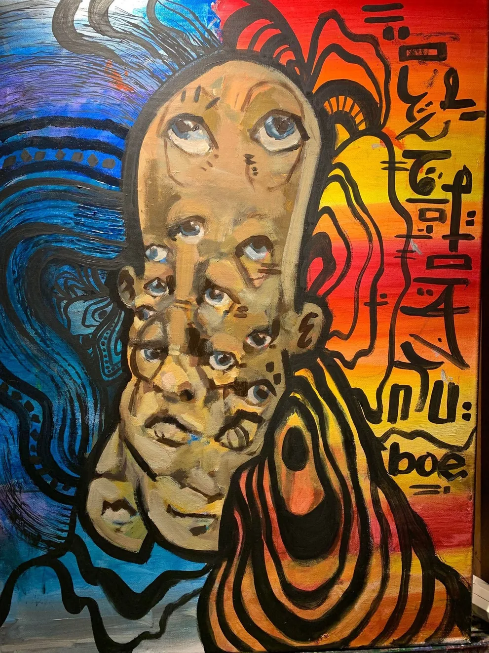 Surreal multi-eyed painted face against a split blue and red background