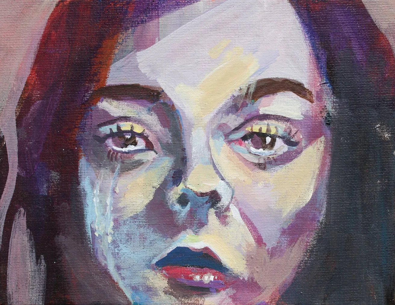 Close-up expressive portrait in purples, reds and blues