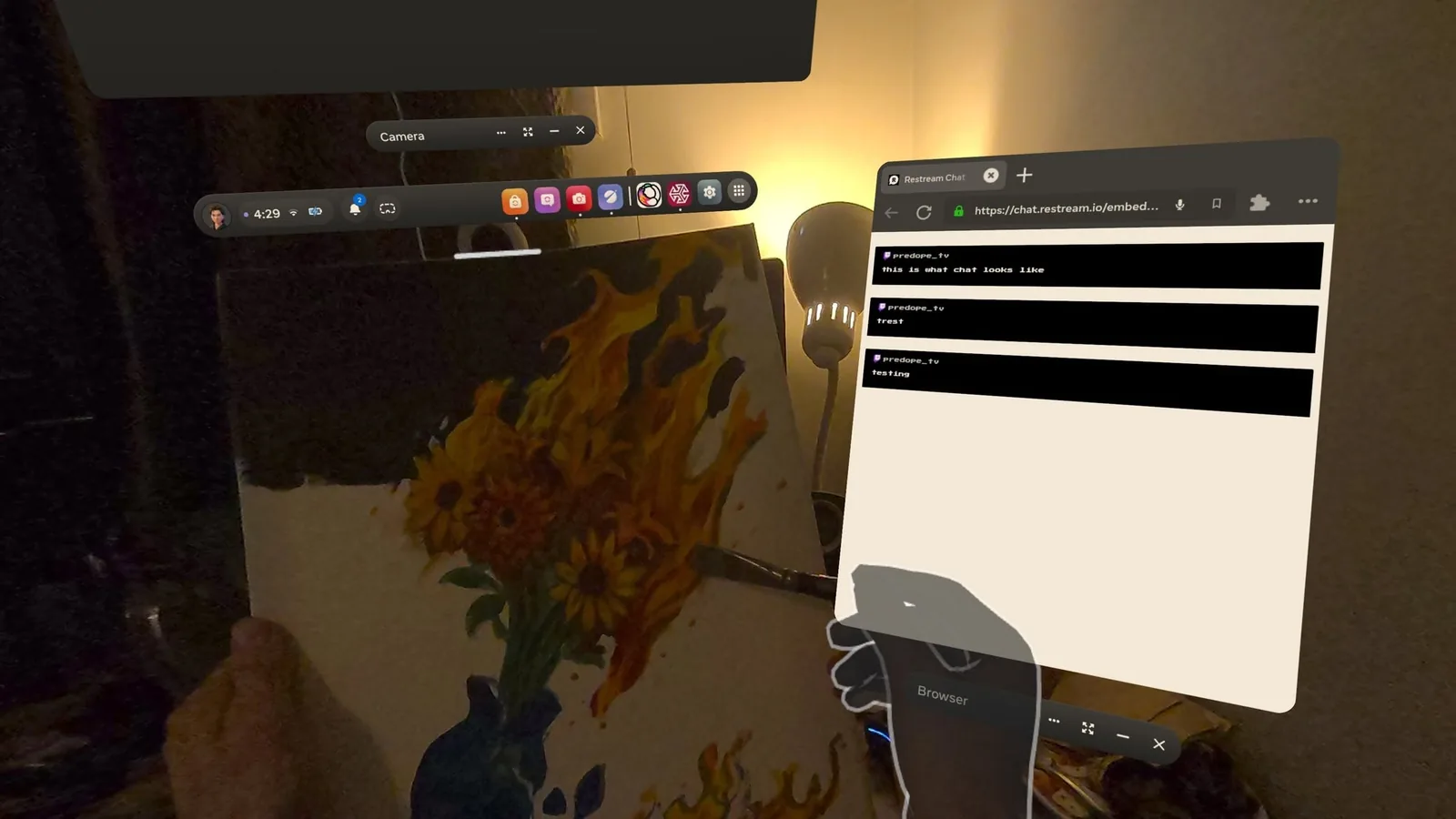 PicassOS first-person streaming view with Restream chat overlay and camera controls