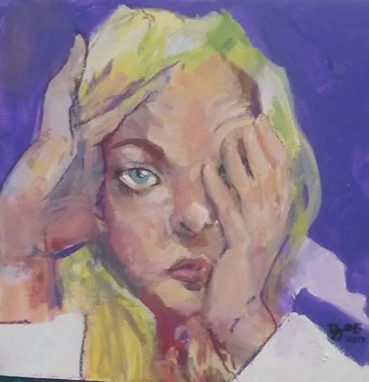 Expressive blonde portrait with hands framing the face